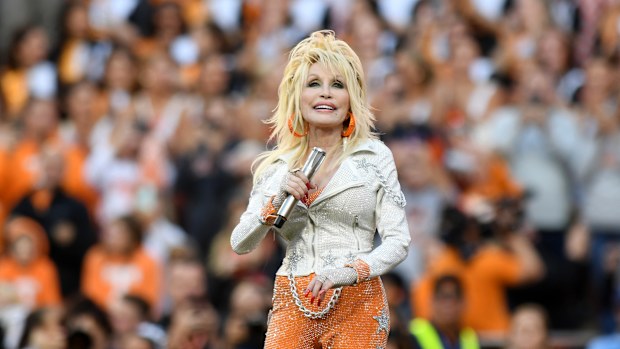 KNOXVILLE, TN - NOVEMBER 18: Dolly Parton performs during the college football game between the Georgia Bulldogs and the Tennessee Volunteers on November 18, 2023, at Neyland Stadium in Knoxville, TN. (Photo by Jeffrey Vest/Icon Sportswire via Getty Images)