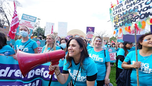 A childcare worker rally for better pay