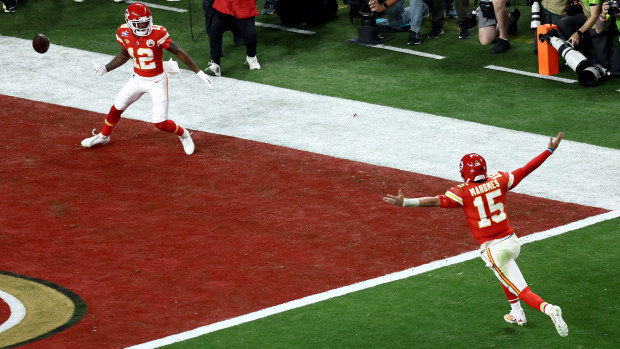 Patrick Mahomes (right) celebrates after throwing the Super Bowl winning pass.