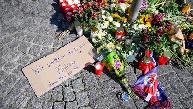 Flowers, candles and tributes near to the site of stabbings that left three dead and eight injured on August 24 in Solingen, Germany.