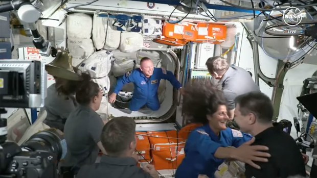 Astronauts Suni Williams and Butch Wilmore are seen entering the International Space Station