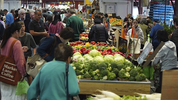 General photo of people shopping for fruits and vegetables at the Queen Vic Market on Friday 2, December 2023. inflation consumer economy