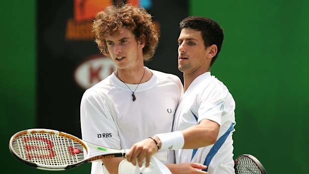 Andy Murray of Great Britain and Novak Djokovic of Serbia celebrate a point.