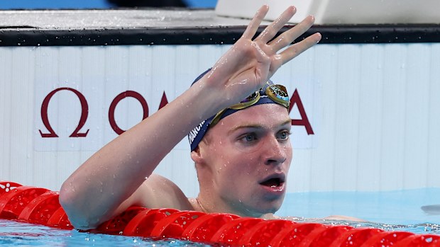 Count 'em: Leon Marchand celebrates gold number four.