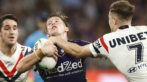 Harry Grant of the Storm is tackled by Sam Walker of the Roosters during the NRL Semi Final match between Melbourne Storm and the Sydney Roosters at AAMI Park on September 15, 2023 in Melbourne, Australia. (Photo by Daniel Pockett/Getty Images)