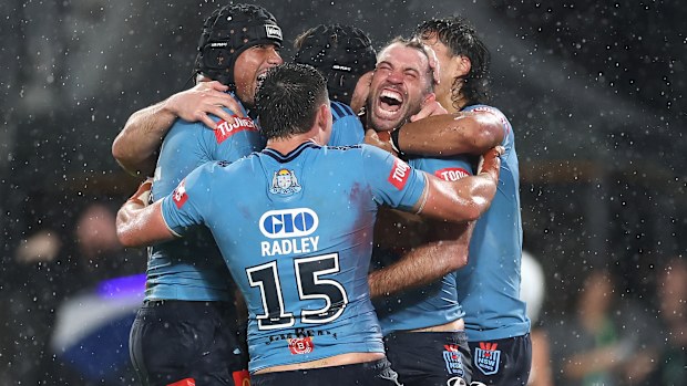 SYDNEY, AUSTRALIA - MAY 27: James Tedesco of the Blues celebrates scoring the match winning try with team mates during game one of the 2026 Men's State of Origin series between New South Wales Blues and Queensland Maroons at Accor Stadium on May 27, 2026 in Sydney, Australia. (Photo by Cameron Spencer/Getty Images)
