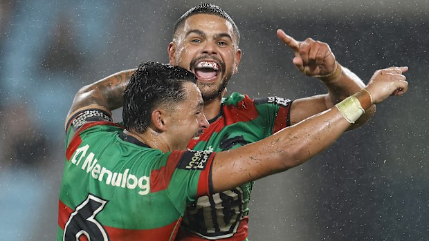 Latrell Mitchell celebrates after scoring a try.