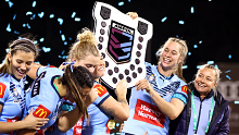 The Blues players celebrate winning the one-off Women's State of Origin match last year