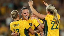 MELBOURNE, AUSTRALIA - FEBRUARY 28: Amy Sayer of Australia celebrates with team mates after scoring a goal during the AFC Women's Olympic Football Tournament Paris 2024 Asian Qualifier Round 3 match between Australia Matildas and Uzbekistan at Marvel Stadium on February 28, 2024 in Melbourne, Australia. (Photo by Robert Cianflone/Getty Images)