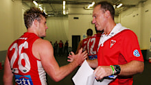 Swans head coach John Longmire celebrates a win with Luke Parker.