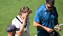 HOBART, AUSTRALIA - MARCH 03: Will Pucovski of the Bushrangers is helped from the field by medical staff after being struck by a delivery from Riley Meredith of the Tigers during the Sheffield Shield match between Tasmania and Victoria at Blundstone Arena, on March 03, 2024, in Hobart, Australia. (Photo by Steve Bell/Getty Images)