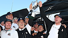 Crew of the Master Lock Comanche celebrate after crossing the finish line.