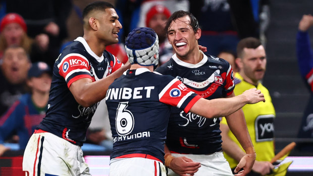 Billy Smith of the Roosters celebrates scoring a try.