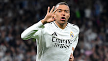 Kylian Mbappe of Real Madrid celebrates scoring his hat trick.