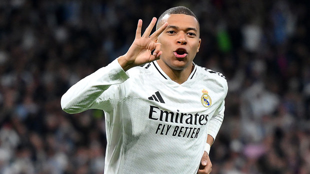 Kylian Mbappe of Real Madrid celebrates scoring his hat trick.