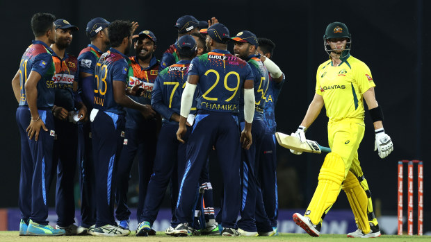 Sri Lankan players celebrate after taking the wicket of Steve Smith.