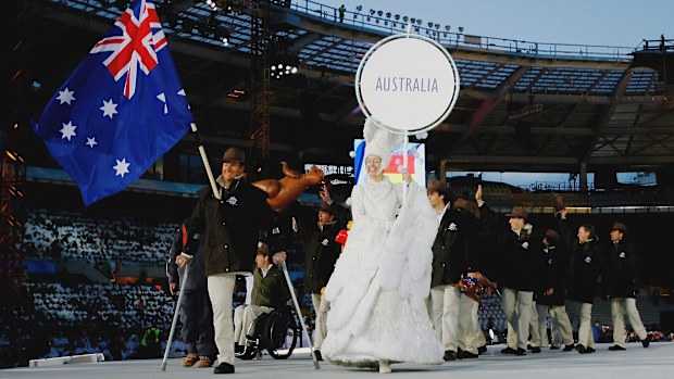 The paralympic team from Australia led by flagbearer Michael Milton enters the stadium during the Opening Ceremony of the Turin 2006 Winter Paralympic Games.