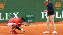 Djokovic argues with the chair umpire Aurelie Tourte after a bad line call.
