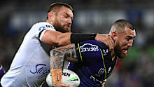 MELBOURNE, AUSTRALIA - AUGUST 26:  Nelson Asofa-Solomona of the Storm is tackled by Jared Waerea-Hargreaves of the Roosters  during the round 24 NRL match between the Melbourne Storm and the Sydney Roosters at AAMI Park on August 26, 2022, in Melbourne, Australia. (Photo by Quinn Rooney/Getty Images)