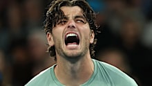 MELBOURNE, AUSTRALIA - JANUARY 22: Taylor Fritz of the United States celebrates match point against Vit Kopriva of the Czech Republic in the Men's Singles Second Round during day five of the 2026 Australian Open at Melbourne Park on January 22, 2026 in Melbourne, Australia. (Photo by Cameron Spencer/Getty Images)