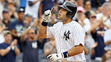 New York Yankees player Jesús Montero celebrates hitting his first major league home run.