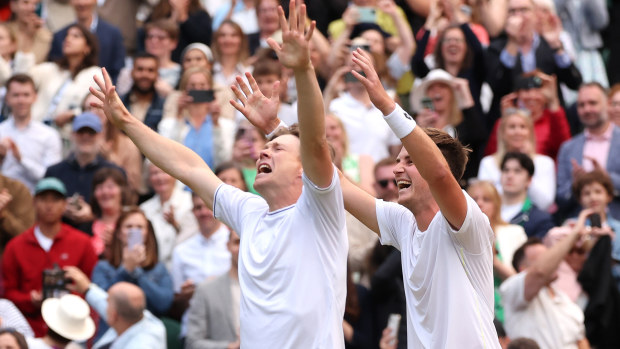 Harri Heliovaara of Finland and Henry Patten of Great Britain celebrate winning Championship point against Max Purcell and Jordan Thompson of Australia in the Gentlemen's Doubles Final during day thirteen of The Championships Wimbledon 2024 at All England Lawn Tennis and Croquet Club on July 13, 2024 in London, England. (Photo by Julian Finney/Getty Images)