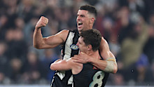Scott Pendlebury celebrates a win in game 400 with Lachie Schultz.