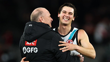 Ken Hinkley, Senior Coach of the Power and Connor Rozee celebrate their win over the Saints.
