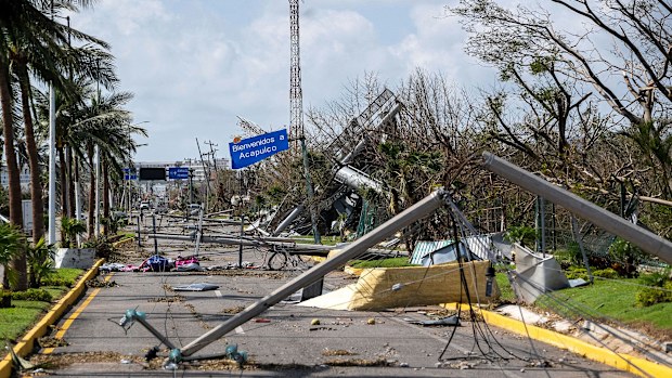 Downed electrical poles and lines blown over by Hurricane Otis