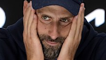 Novak Djokovic of Serbia reacts at a press conference after retiring in his semifinal match against Alexander Zverev of Germany at the Australian Open tennis championship in Melbourne, Australia, Friday, Jan. 24, 2025. (AP Photo/Asanka Brendon Ratnayake)