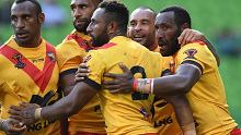 Papua New Guinea Kumuls players celebrate a try against England at the 2017 Rugby League World Cup quarter finals.