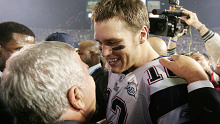 Brady celebrates with Kraft after a Super Bowl win.