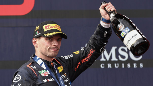 Max Verstappen of the Netherlands and Oracle Red Bull Racing celebrates his win on the podium during the F1 Grand Prix of Emilia-Romagna at Autodromo Enzo e Dino Ferrari Circuit on May 19, 2024 in Imola, Italy.(Photo by Qian Jun/MB Media/Getty Images)