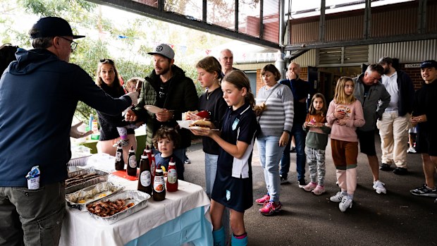 Voters queue for a democracy sausage.