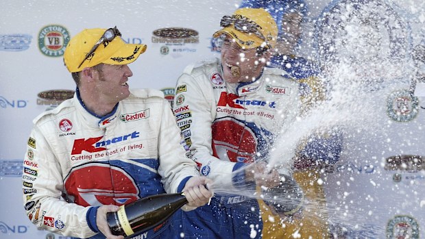 Greg Murphy and co driver Rick Kelly of the KMart Racing Team celebrate their win in the Bob Jane Bathurst 1000, which is round 10 of the V8 Supercar Championship October 12, 2003 at the Mount Panorama Circuit, Bathurst, Australia. (Photo by Robert Cianflone/Getty Images)