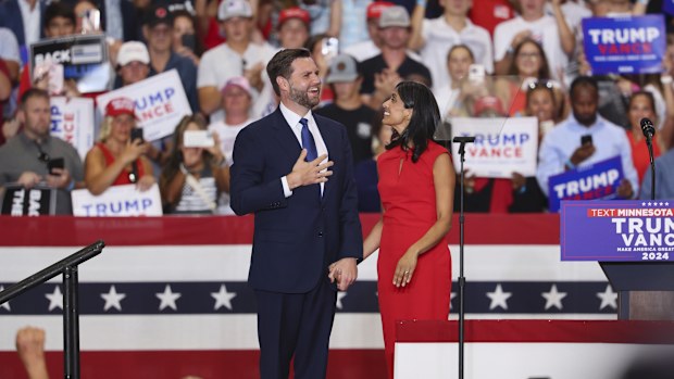 Republican vice presidential candidate Sen. JD Vance, R-Ohio, and his wife Usha Vance arrive to speak at a campaign rally, Saturday, July 27, 2024, in St. Cloud, Minn.  (AP Photo/Adam Bettcher)
