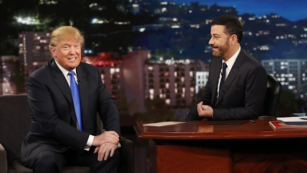 This photo provided by ABC shows guest Republican Presidential candidate Donald Trump, left, with host Jimmy Kimmel, on Jimmy Kimmel Live on Wednesday, Dec. 16, 2015, in Los Angeles. The ABC show airs every weeknight, 11:35 p.m. - 12:41 a.m., ET. (Randy Holmes/ABC via AP)
