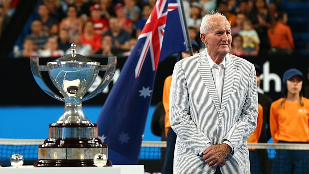 Neale Fraser presents the Hopman Cup trophy to Roger Federer and Belinda Bencic.