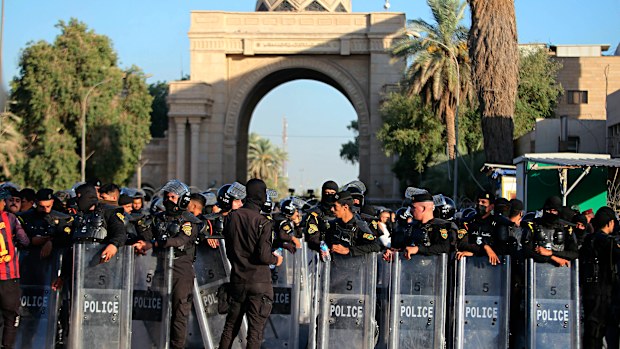 A file photo of Iraqi security forces stand guard outside the heavily fortified Green Zone during protests in Baghdad, Iraq in July.