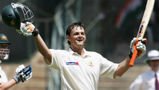Adam Gilchrist of Australia celevrates his century during day two of the First Test between India and Australia played at the Chinnaswamy Stadium on October 7, 2004 in Bangalore, India. (Photo by Hamish Blair/Getty Images)