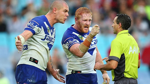 David Klemmer and James Graham of the Bulldogs confront referee, Gerard Sutton after awarding the Rabbitohs a late penalty during the round five NRL match between the Canterbury Bulldogs and the South Sydney Rabbitohs at ANZ Stadium on April 3, 2015 in Sydney, Australia. (Photo by Brendon Thorne/Getty Images)