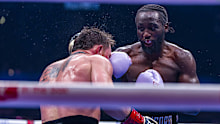 Canelo Alvarez takes a punch to the face from Terence Crawford during their undisputed super middleweight championship fight 