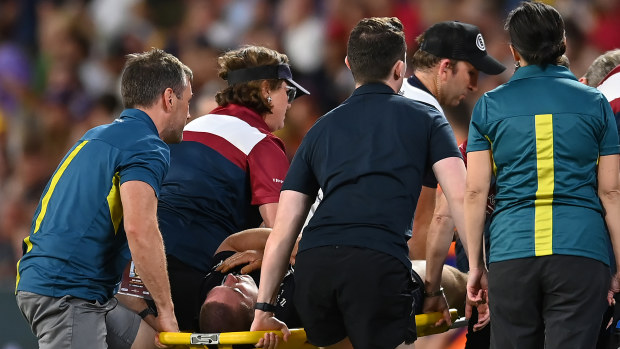 Lachlan Lonergan of the Brumbies is stretchered off the field after suffering an injury.
