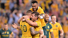 Quade Cooper and Samu Kerevi congratulate Bernard Foley after his 2016 try.