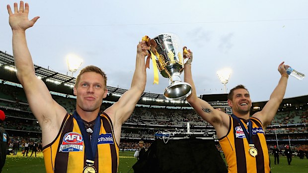 Luke Hodge and Sam Mitchell in 2013 with the premiership cup.