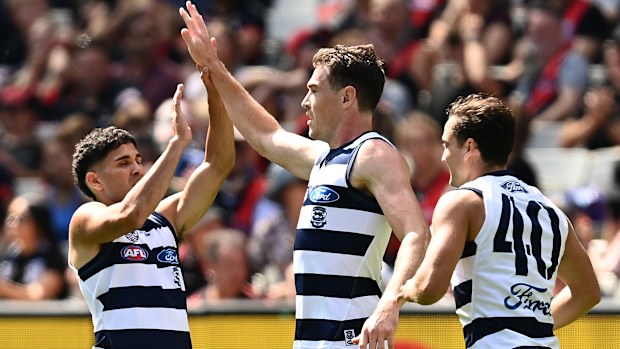 Jeremy Cameron is congratulated by teammates after scoring a goal against Essendon.