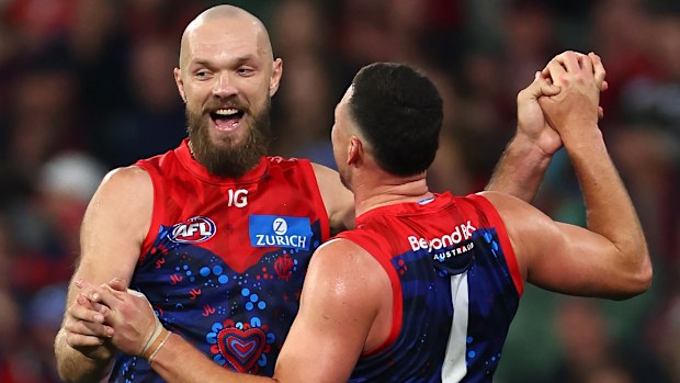 Steven May of the Demons is congratulated by Max Gawn