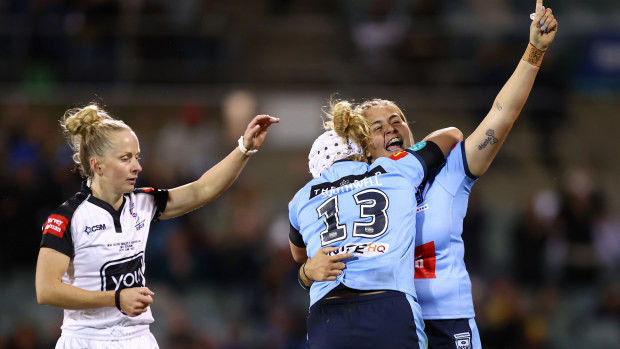 Caitlan Johnston and Hannah Southwell of the Blues celebrate winning the 2022 Women's State of Origin match.