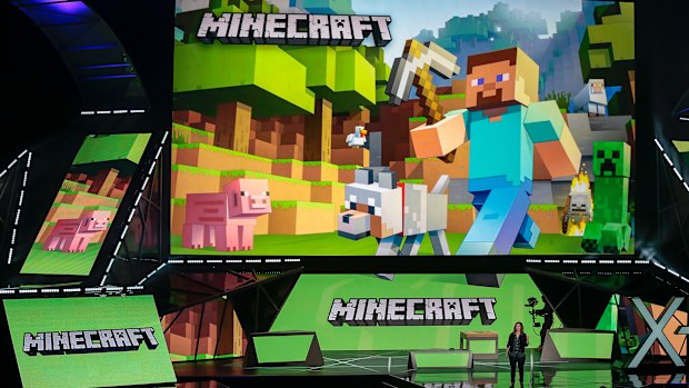 FILE - Lydia Winters shows off Microsoft's "Minecraft" built specifically for HoloLens at the Xbox E3 2015 briefing before Electronic Entertainment Expo, June 15, 2015, in Los Angeles. Security experts around the world raced Friday, Dec. 10, 2021, to patch one of the worst computer vulnerabilities discovered in years, a critical flaw in open-source code widely used across industry and government in cloud services and enterprise software. Cybersecurity experts say users of the online game Minecra