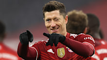 MUNICH, GERMANY - DECEMBER 17: Robert Lewandowski of Muenchen scores his team's fourth goal  during the Bundesliga match between FC Bayern München and VfL Wolfsburg at Allianz Arena on December 17, 2021 in Munich, Germany. (Photo by Alexander Hassenstein/Getty Images)